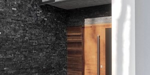 Фасад в отделке 3D панели из натурального камня Кварцит Black Quartz Classic от бренда RKS SLATE фото готового дома (2)